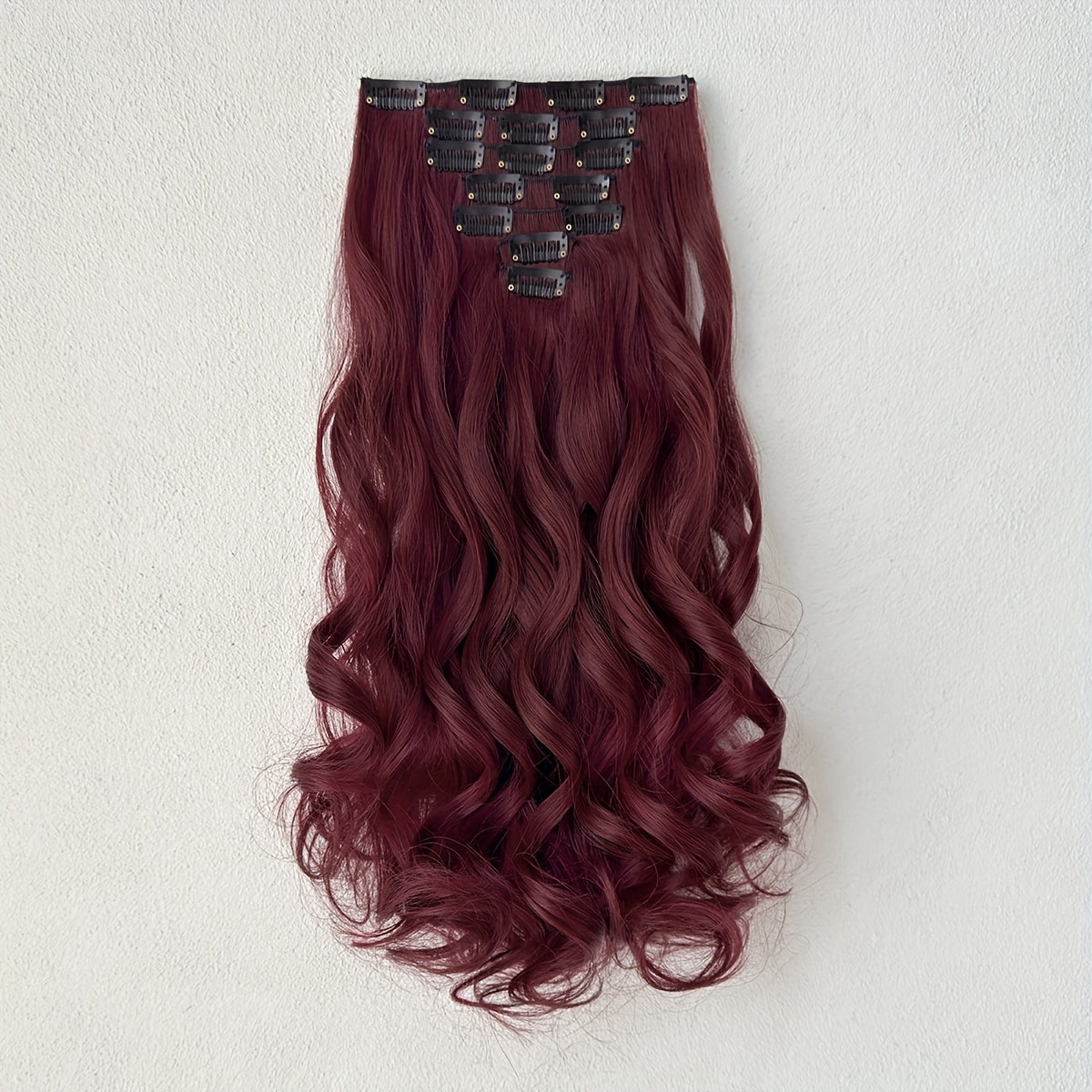 Synthetic Hair Extensions in Black-Brown with 16 Clips, Measuring 22-24 Inches in Length, Featuring a Water Wave Style. This Set Includes 7pcs, Perfect for a Full Head Look for Women.